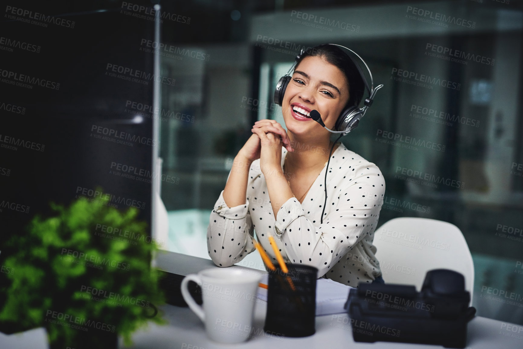 Buy stock photo Cropped portrait of an attractive young businesswoman working late in a call center