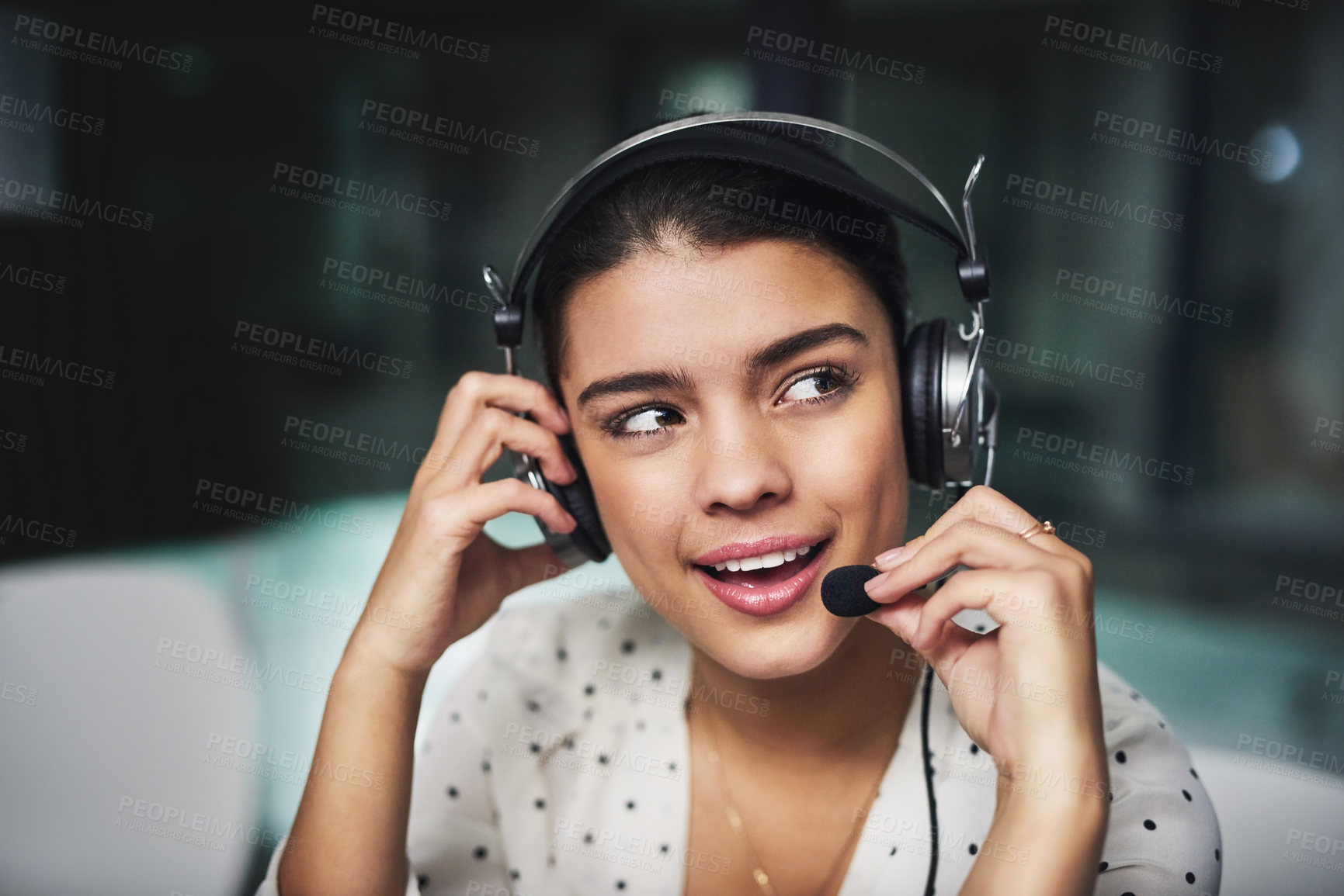 Buy stock photo Cropped shot of an attractive young businesswoman looking thoughtful while working late in a call center
