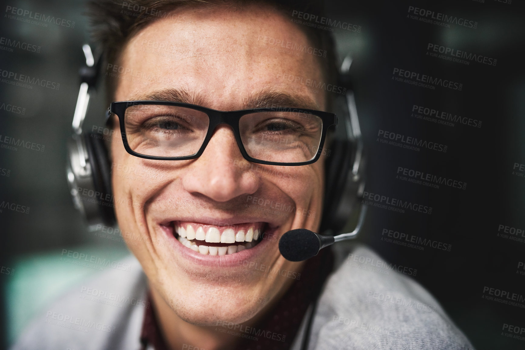 Buy stock photo Cropped portrait of a handsome young businessman working late in a call center