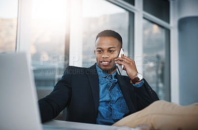 Buy stock photo Black man, laptop and discussion with phone call in relax for proposal or communication at office desk. Businessman, accountant or employee with smile on mobile smartphone for conversation in finance