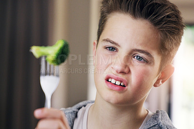 Buy stock photo Disgust, food and fear with child and broccoli for nutrition, health and cooking. Sad, angry and dinner with boy and refuse to eat vegetable  at home for eating problem, frustrated and dislike