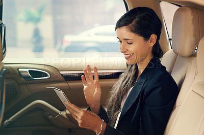 Buy stock photo Video call, travel and businesswoman in taxi with mobile phone for contact, communication or morning commute to office. Smile, smartphone and female person with wave for hello, greeting or gesture