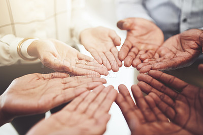 Buy stock photo Closeup shot of a group of businesspeople standing with their hands cupped together