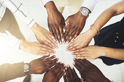 Buy stock photo Closeup shot of a group of businesspeople joining their hands together