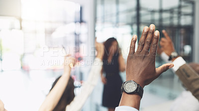 Buy stock photo Closeup shot of a group of businesspeople raising their hands during a presentation in an office