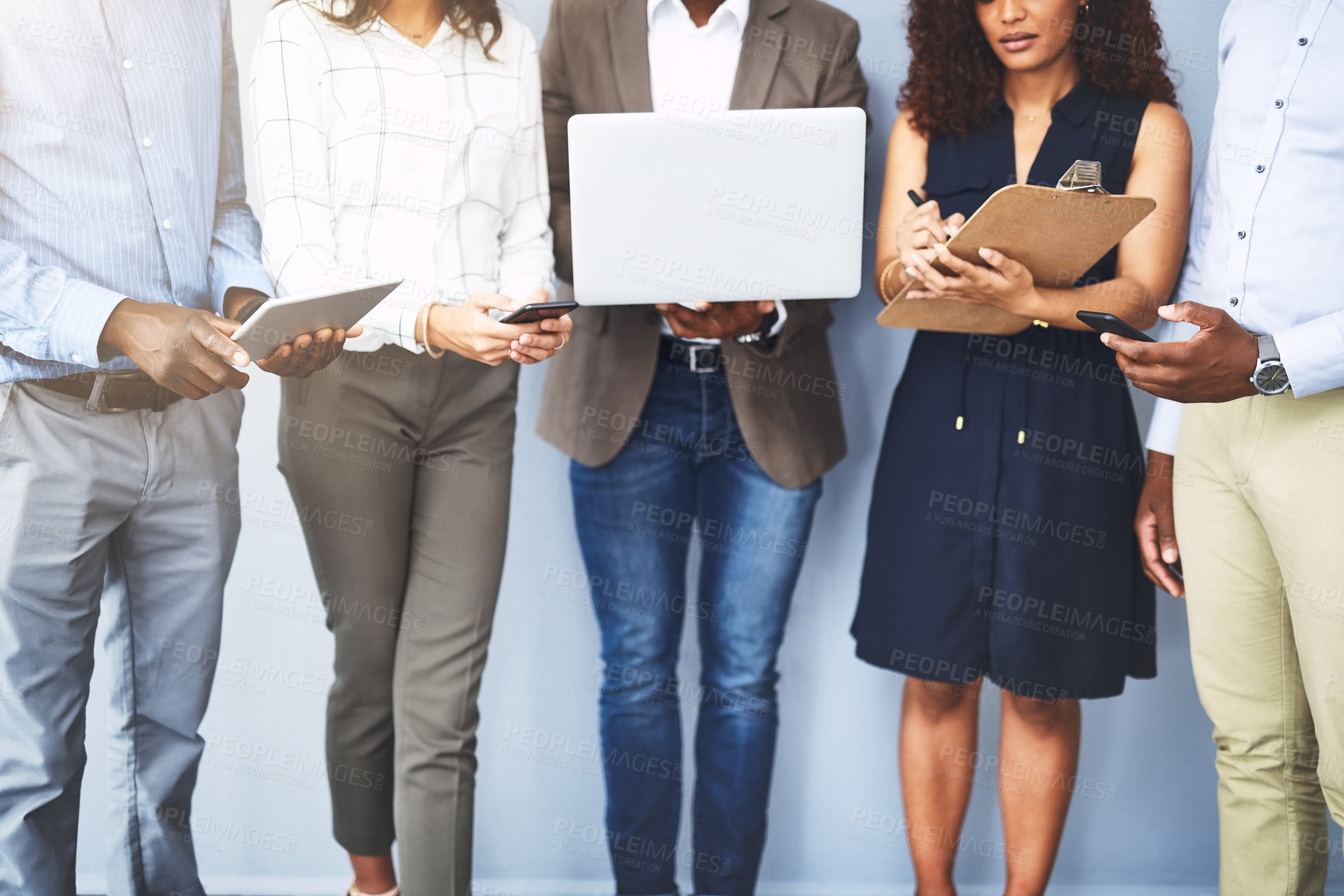 Buy stock photo Technology, waiting room and row of business people in office for job interview, hiring and networking. Diversity, queue and men and women with laptop and tablet for recruitment on wall background