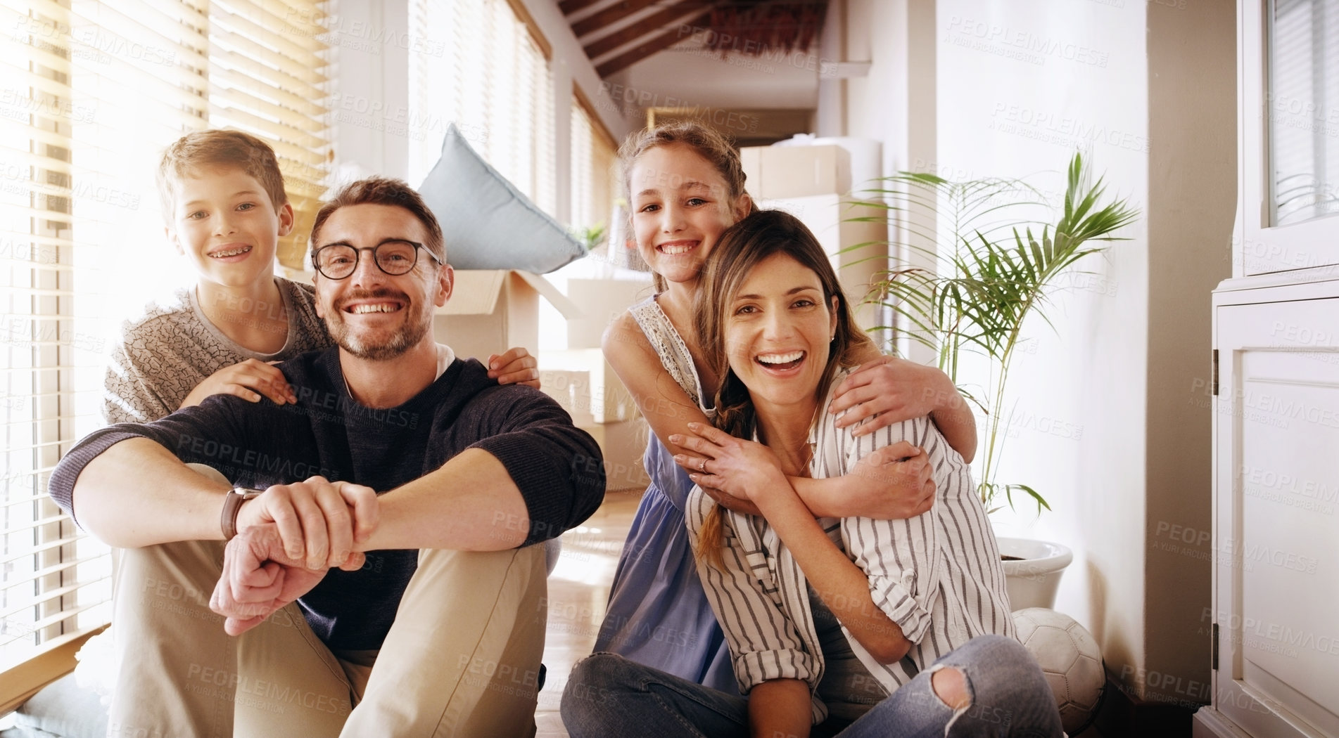 Buy stock photo Parents, children and a portrait of a family moving house for a new start after real estate purchase. Homeowner mom, dad and kids as happy people in the living room of their property investment