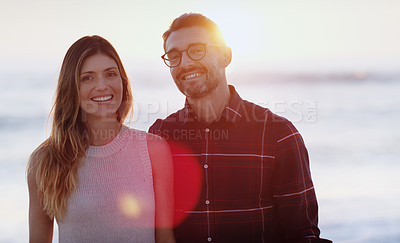 Buy stock photo Sunset, beach and portrait of happy couple hug in nature with love, fun or bonding on adventure. Travel, marriage or people embrace at sea for holiday, vacation or romantic anniversary celebration