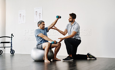 Buy stock photo Dumbbells, physiotherapy and rehabilitation with doctor and patient for help, training and stretching. Healthcare, wellness and healing with old man and expert for consulting, muscle and exercise