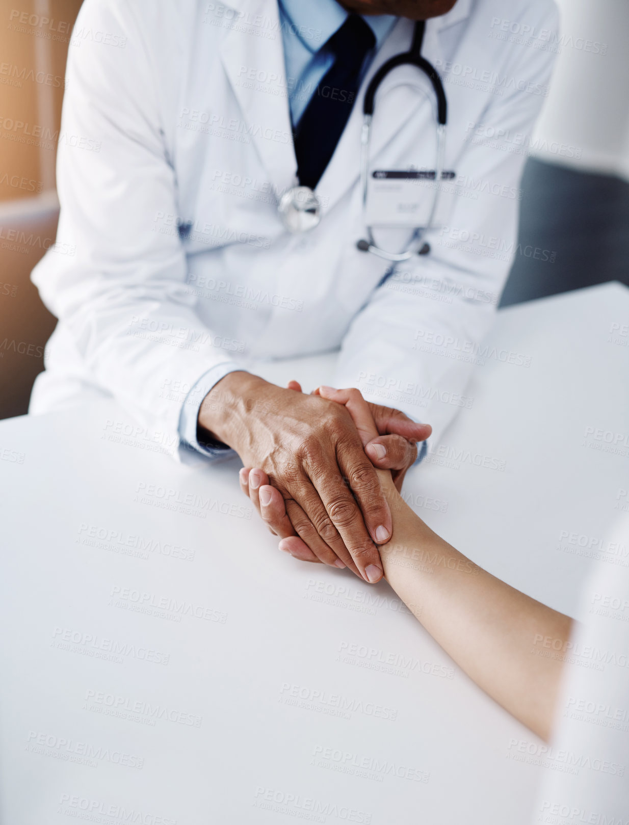 Buy stock photo Holding hands, doctor and patient for help, talking or communication for bad news, diagnosis or support. Cardiologist, medical discussion or empathy together for comfort, care or wellness in hospital