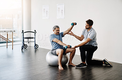 Buy stock photo Dumbbells, physiotherapy and balance with doctor and old man for rehabilitation, training and stretching. Healthcare, wellness and healing with patient and expert for consulting, muscle and exercise