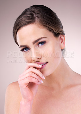 Buy stock photo Clean, woman and portrait for skincare in studio on pink background for smooth face, glow or natural shine. Facial, proud model or confident person with cosmetics, beauty or transformation results