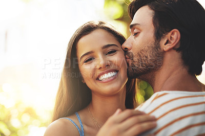 Buy stock photo Portrait, holiday or happy couple kiss in nature to date, smile or enjoy anniversary together for love. Outdoor, romantic or people in park for trust or bonding with care, support or special moment