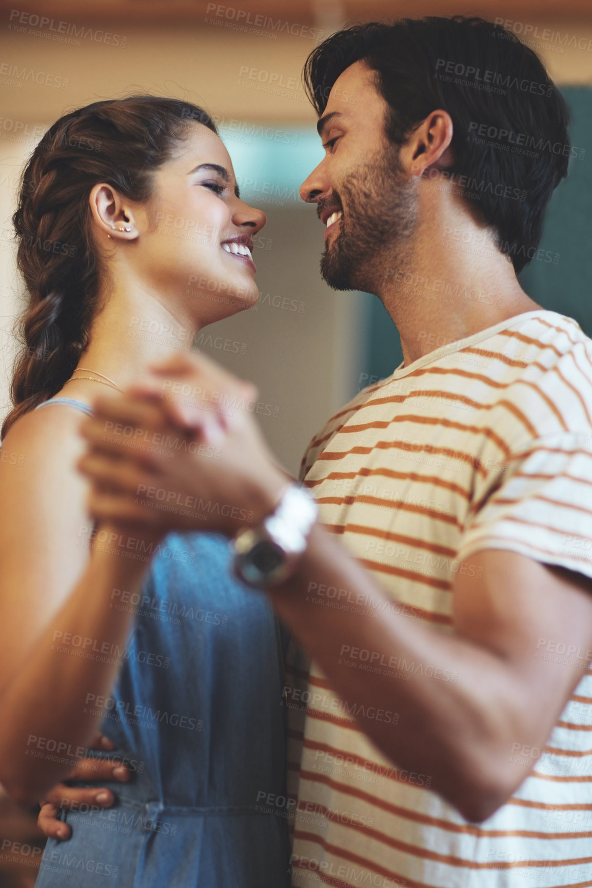 Buy stock photo Couple, happy and dancing in house for love, relationship and romance on weekend with hug in lounge. Man, woman and holding hands in living room of home for support, anniversary and trust together