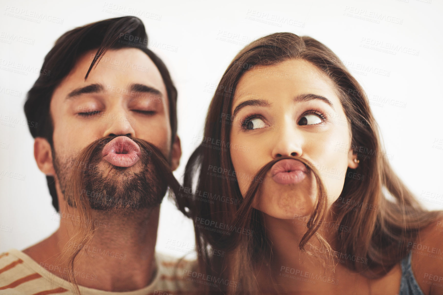 Buy stock photo Couple, house and hair mustache with playful, fun and kissing face with meme, bonding and love together. Young man, woman and silly romance for relaxing pout with care, happiness and comic joke