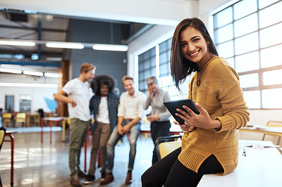 Buy stock photo Cropped portrait of an attractive young businesswoman in the office with his colleagues in the background
