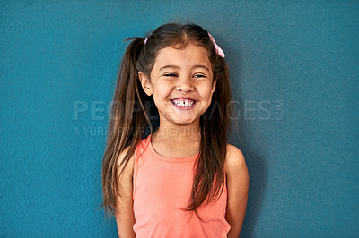 Buy stock photo Studio, child or girl with laughing for fashion, cotton clothes and comfortable with pride for cool style. Mockup space, female person or kid with comedy for childhood joke, happy and blue background