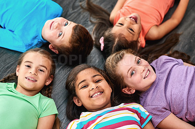 Buy stock photo Above, circle and portrait of children on floor for playing, friendship and bonding in classroom. Diversity, youth and group of kids with smile for learning, education and development at school