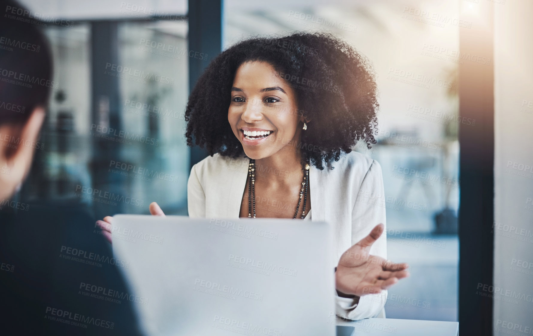 Buy stock photo Shot of two businesswomen having a discussion in an office