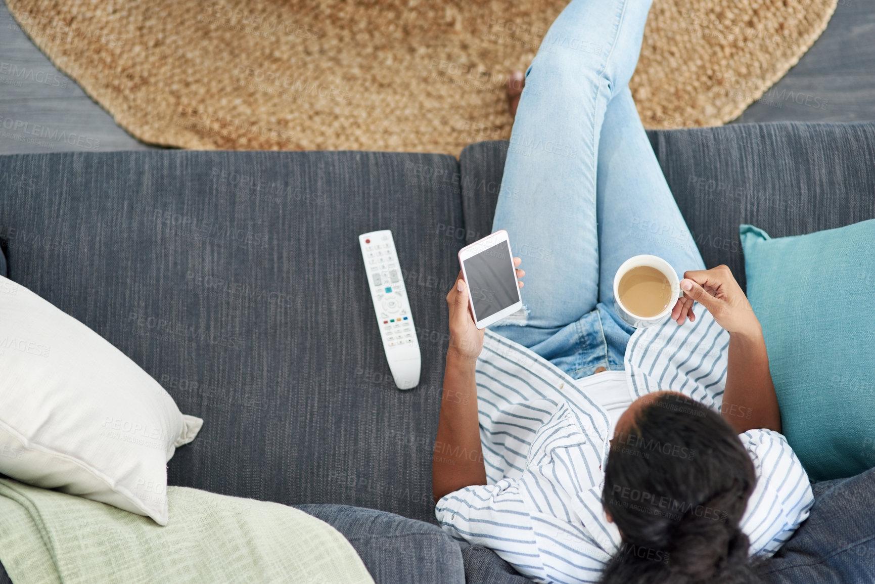 Buy stock photo Relax, coffee and black woman with cellphone, couch and reading of post in social media and top view. House, online and girl with mobile for review of series, digital and app for entertainment