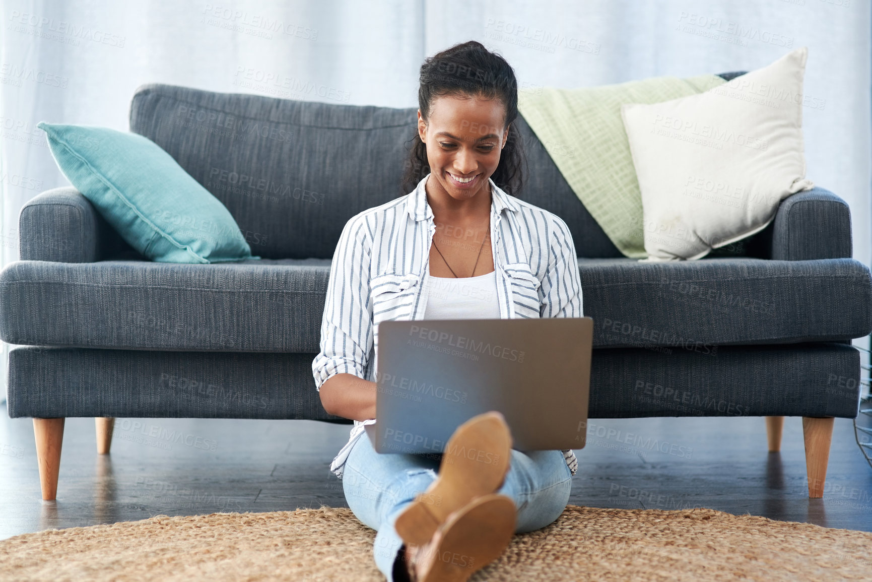 Buy stock photo Woman, typing and laptop in home on floor, happy and smiling for weekend break in apartment. Online , streaming and website search or remote work in living room, ecommerce browsing and blog update