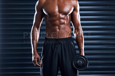 Buy stock photo Cropped shot of an unrecognizable man working out with weights