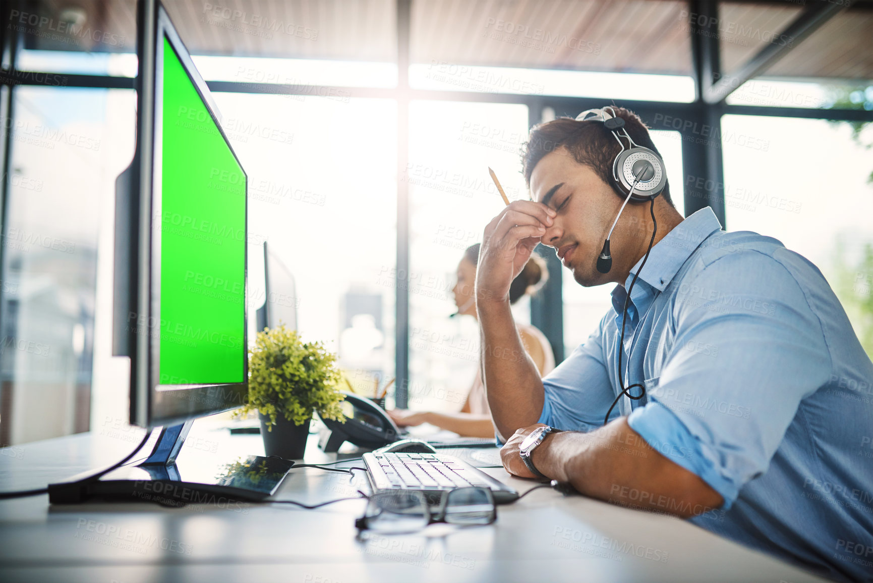 Buy stock photo Businessman, call center and headache with green screen in burnout, stress or overworked at office. Man person, consultant or agent with bad head pain or anxiety with mockup chromakey at workplace
