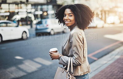 Buy stock photo Portrait of a young businesswoman walking in the city