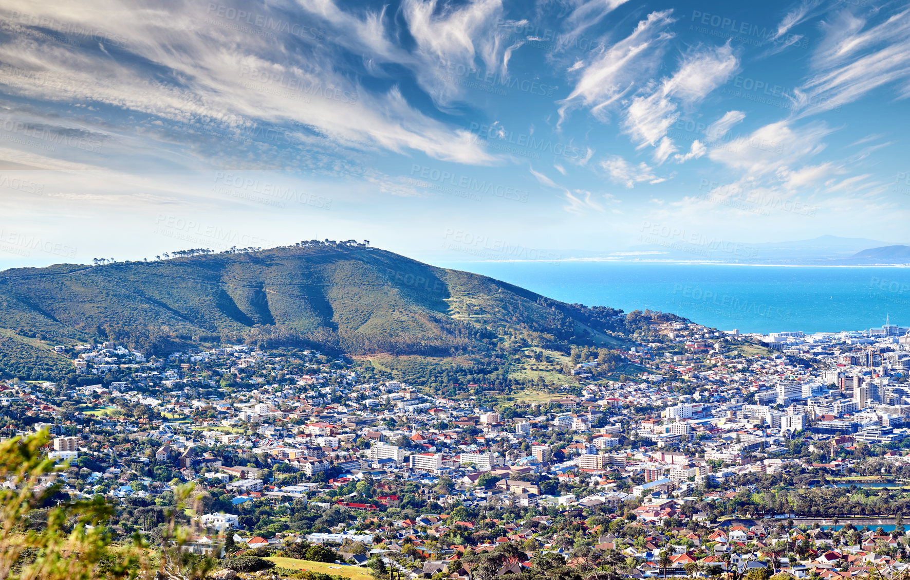 Buy stock photo Copy space with cloudy blue sky over the view of a coastal city seen from Signal Hill in Cape Town South Africa. Scenic panoramic landscape of buildings in an urban town along the mountain and sea