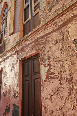 Buy stock photo Exterior of an old building with peeling paint. Architecture details of an ancient, weathered rustic residential build with vintage wooden doors and windows in Santa Cruz de La Palma