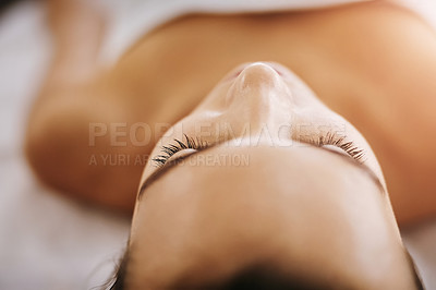 Buy stock photo Closeup shot of a woman feeling relaxed while lying on a spa bed