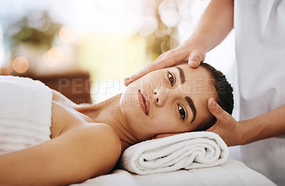 Buy stock photo Cropped shot of a beautiful young woman getting a head massage at a spa