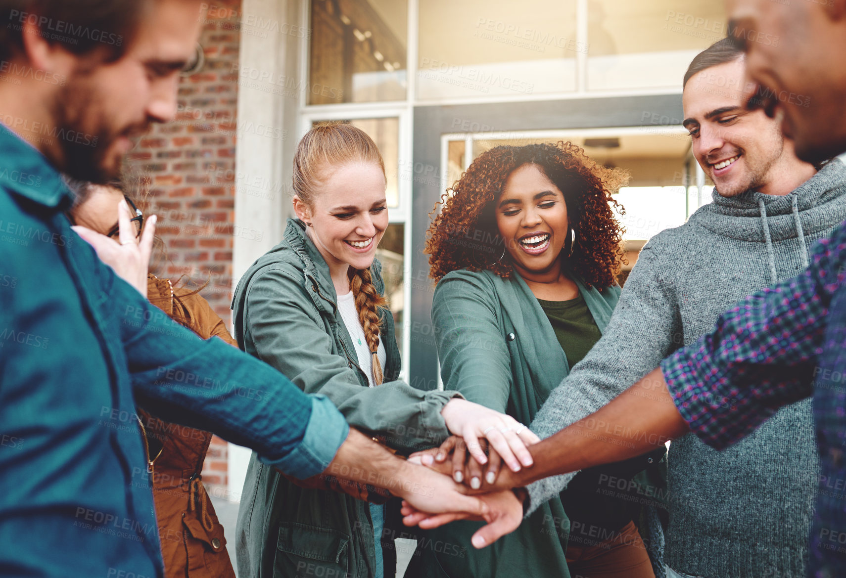 Buy stock photo Smile, students and hands stack for support outdoor at university, agreement or synergy of studying goal. Diversity, happy and people with team building, trust and learning of knowledge development