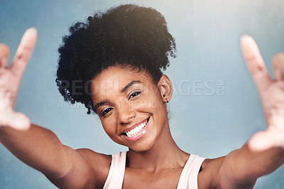 Buy stock photo Cropped shot of a beautiful young woman using her hands to make a picture frame