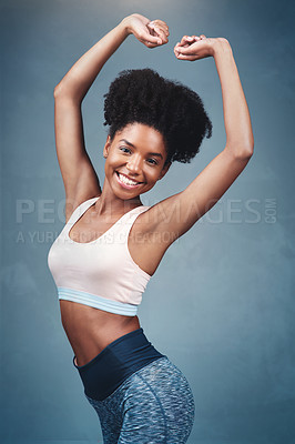 Buy stock photo Studio shot of an attractive young woman in exercise clothing against a gray background