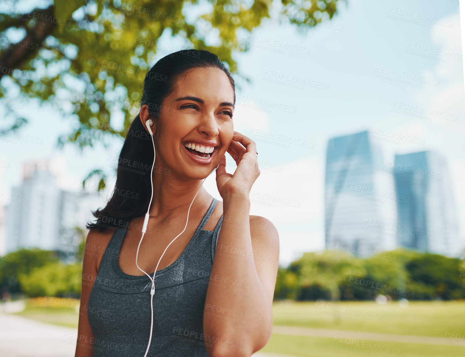 Buy stock photo Fitness, happy and woman in city with music for exercise, marathon training and running for wellness. Sports, urban park and person with earphones listening to workout playlist, audio and radio