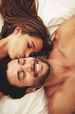 Buy stock photo Above, couple and romance with kiss, moment and love in home for bonding, relax and sleep on weekend. Woman, man and connection for marriage, commitment and partner with happy, care and affection