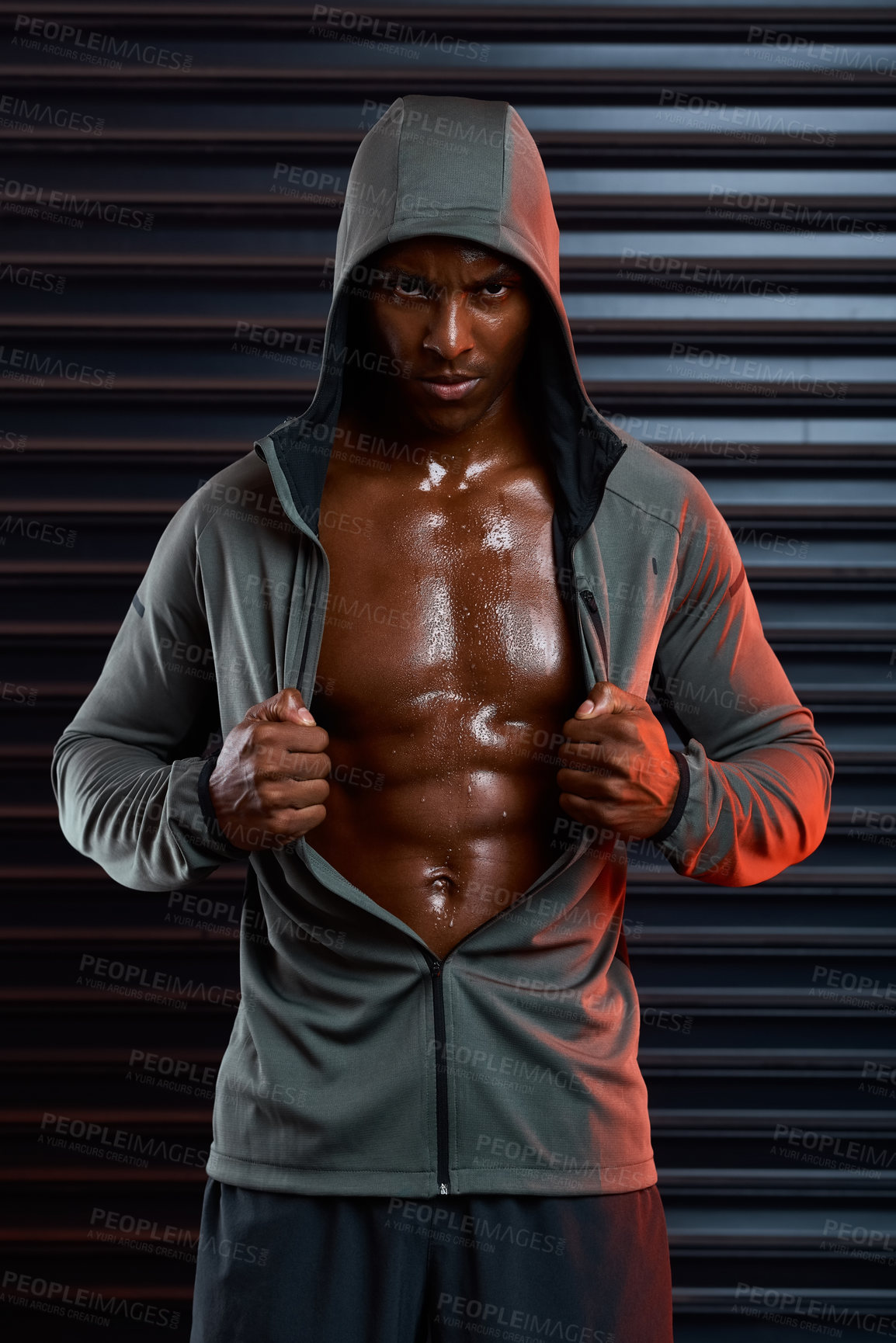 Buy stock photo Studio shot of an athletic young man posing against a grey background