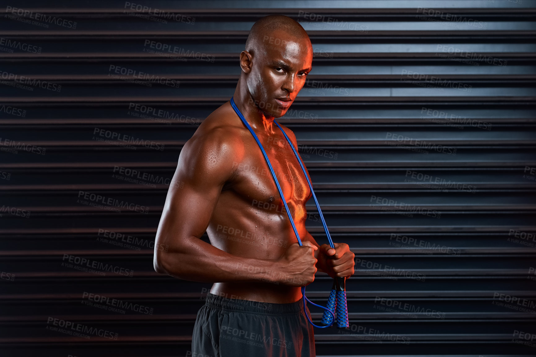 Buy stock photo African man, portrait and exercise for athlete, fitness and healthy for bodybuilding, abs and ready for boxing. Black background, competitive and person with jump rope, confidence and proud of body