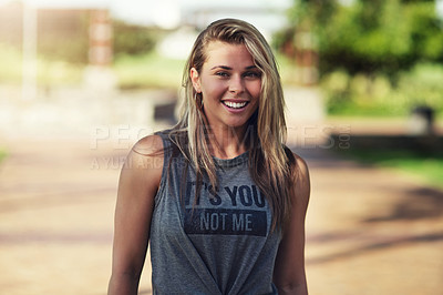 Buy stock photo Portrait of an attractive young woman standing outside in the park