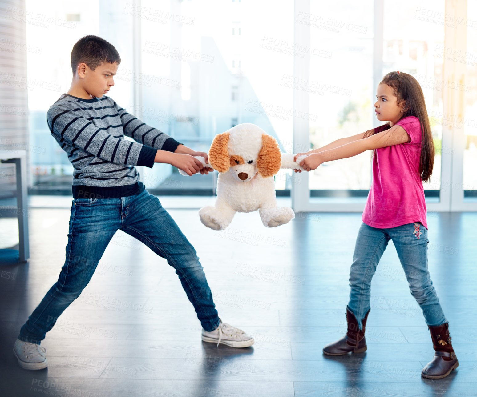 Buy stock photo Children, fight or pulling toy in anger, problem or frustrated with youth at home in living room. Young, argument or conflict in house, apartment or bedroom with kids for child development or growth