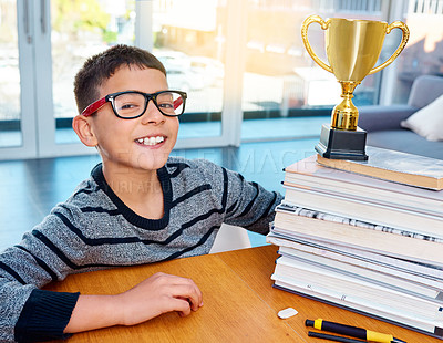 Buy stock photo Portrait, child and smile of student with trophy for success, winning or education achievement in home. Face, kid and school reward of champion in glasses for learning competition or award in Germany