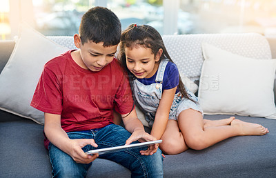 Buy stock photo Tablet, kids and siblings on sofa for play, online and esports for home entertainment. Technology, streaming and internet for video bonding in lounge, gaming or digital games on app for touchscreen