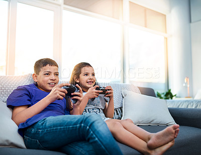 Buy stock photo Kids, siblings and video game with controller, sofa and online for esports in home. Technology, entertainment and virtual challenge for brother and sister, console or couch in living room for fun