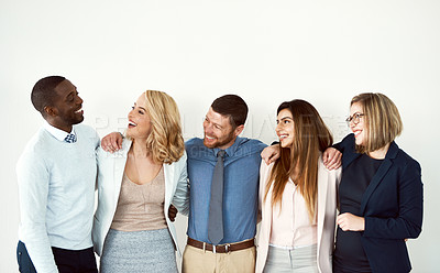 Buy stock photo Studio shot of a group of work colleagues standing with their arms around each other against a white background