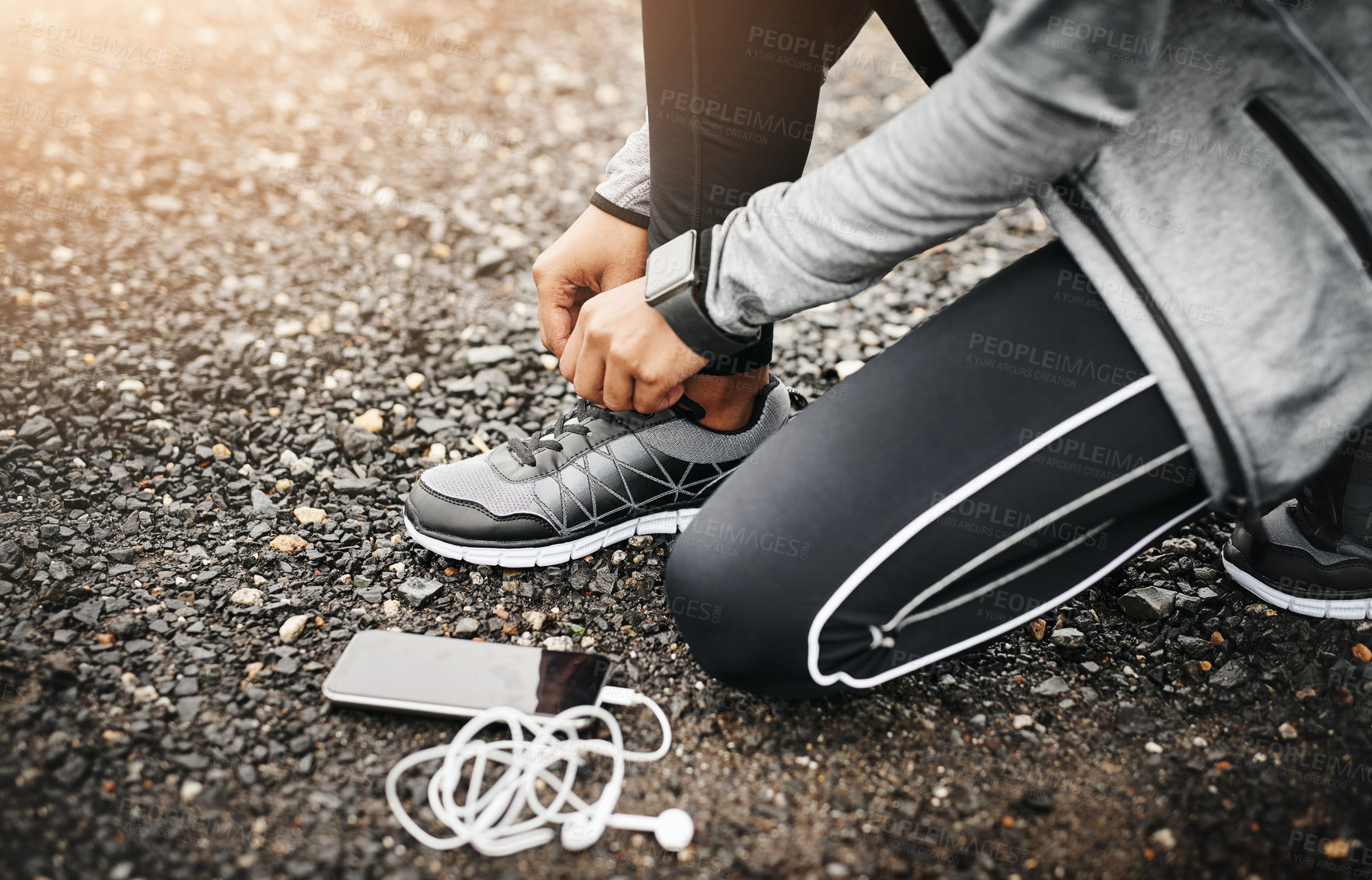 Buy stock photo Person, smartphone and shoelace with running or workout for fitness, health and wellbeing in outdoor. Above, sneakers and committed on exercise or jog in morning for training, wellness and self care