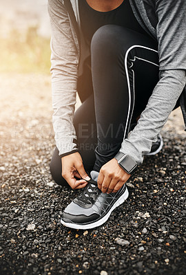 Buy stock photo Person, hands and shoelace with running or workout for fitness, health and wellbeing in outdoor. Above, sneakers and committed on exercise or jog in morning for training, wellness and self care