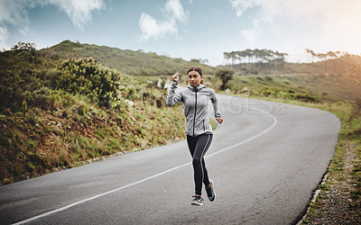 Buy stock photo Road, running or woman with speed for fitness, exercise or training outdoors with endurance for pace. Female athlete, professional runner or action with movement, cardio workout or marathon in nature