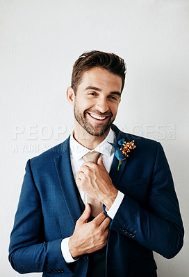 Buy stock photo Studio shot of a handsome young groom against a gray background