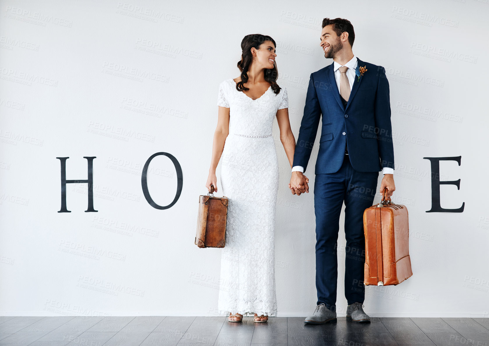 Buy stock photo New home, couple holding hands and mortgage in marriage, luggage or moving in to apartment. Fresh start, happy man and woman on special day with bags, insurance or support for real estate opportunity